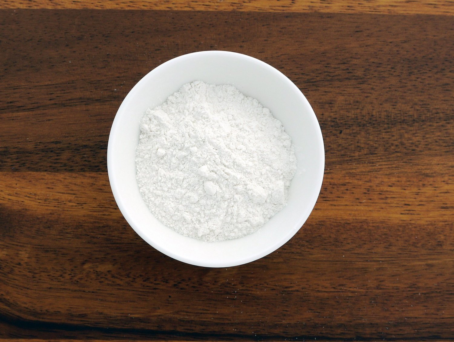 This is an image of a small white bowl containing Cassava Flour from Anthony's Goods
